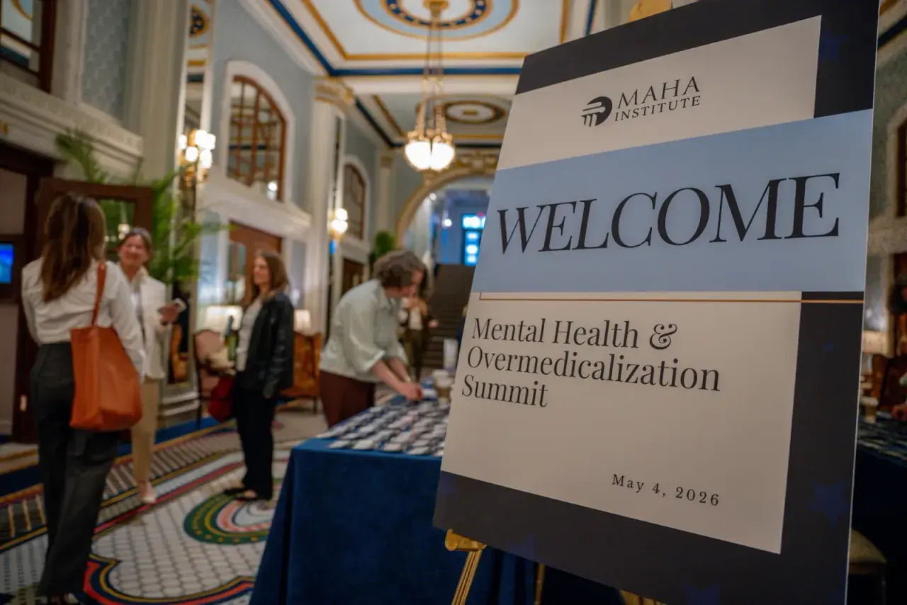 Welcome sign for MAHA Institute Mental Health & Overmedicalization Summit in a historic Washington venue